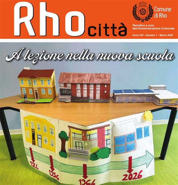 prima pagina di Rho città mese di marzo. A lezione nella nuova scuola. un tavolo con delle scuole in cartone colorare e un cartello con la trasformazione della scuola dal 1924 al 2026