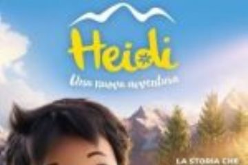 locandina film  Heidi  che tiene in braccio un gattino rosso